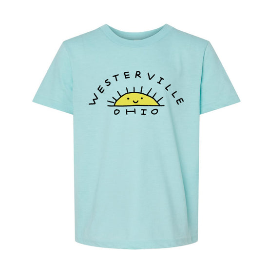 A light blue t-shirt with a graphic design featuring a sun and the text "WESTERVILLE OHIO" printed on it.