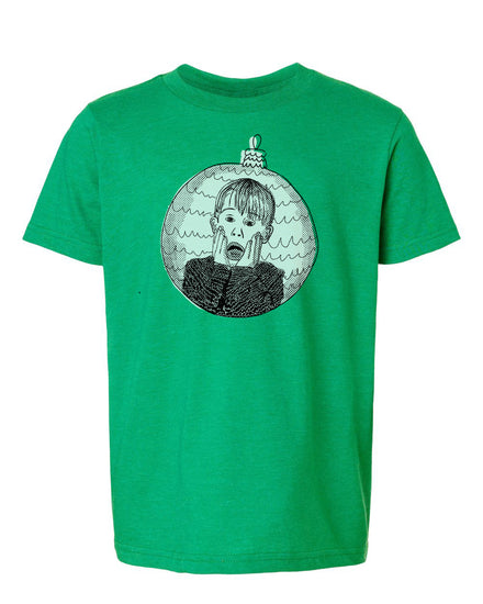 A green t-shirt with a graphic design depicting a person's face with an expression of shock or surprise, surrounded by a circular ornament.