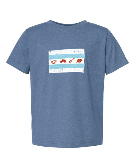 A blue t-shirt with a graphic design featuring a white square with a red and orange border, containing three small images of a person, a bird, and a bear.