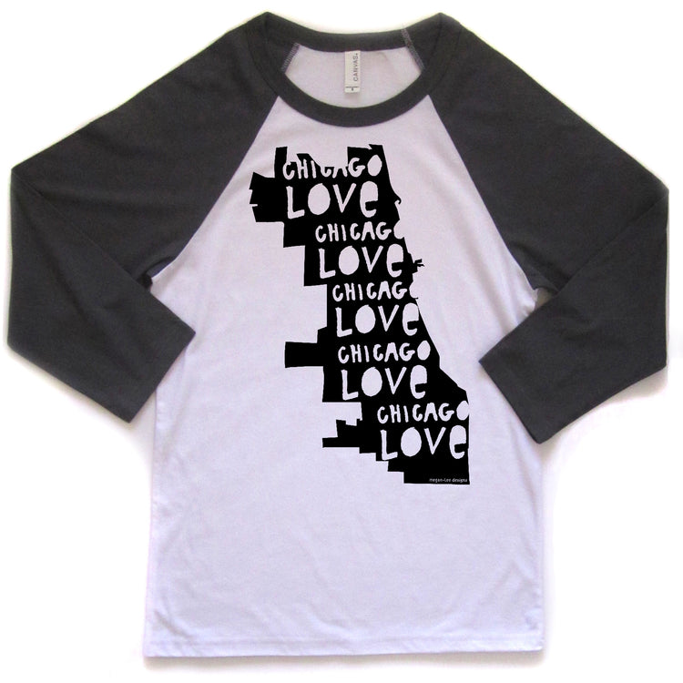 A white and black baseball-style t-shirt with the text "CHICAGO LOVE CHICAGO LOVE CHICAGO LOVE" printed on it in a vertical orientation.