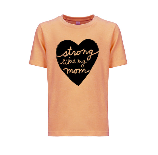 a peach-colored t-shirt with a black heart-shaped graphic and the text "Strong like my mom" printed on it.