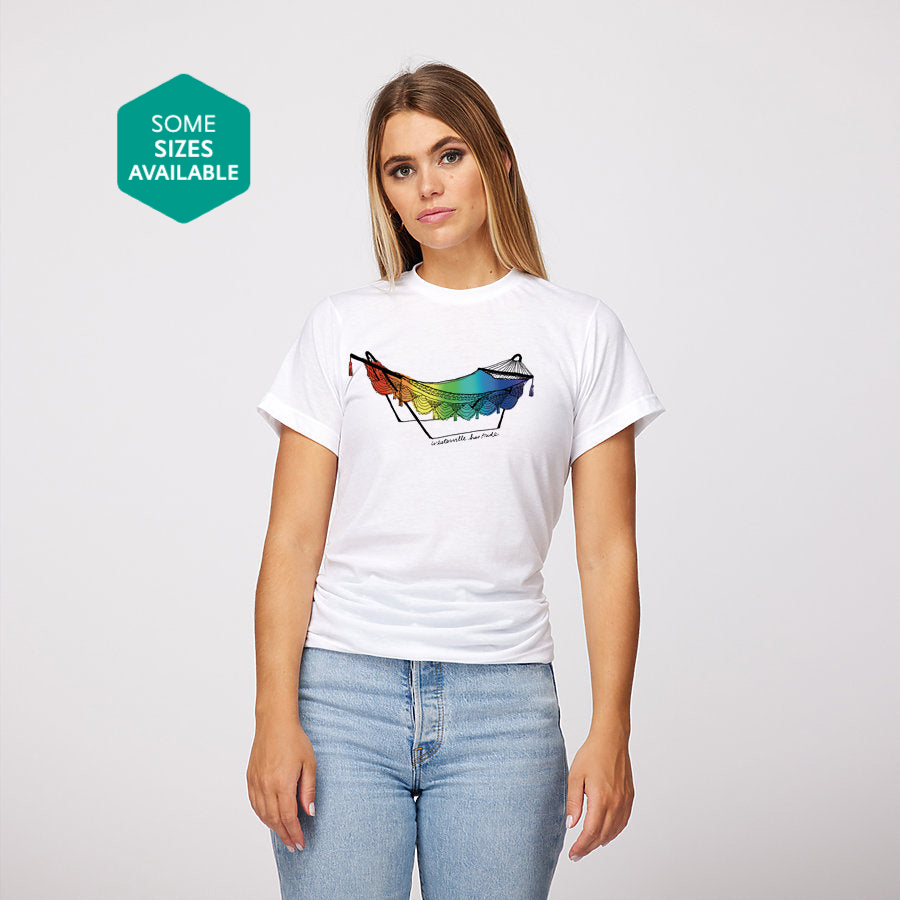 a woman wearing a white t - shirt with a colorful horse on it