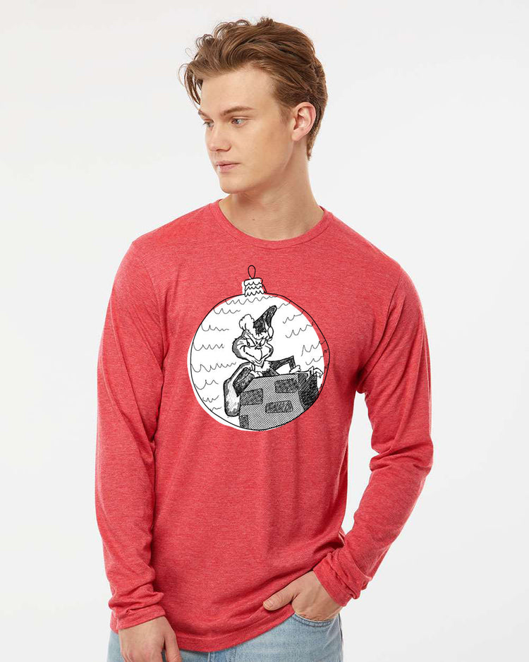 a man wearing a red shirt with a christmas ornament on it