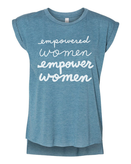 A blue t-shirt with the text "empowered women empower women" printed on it in white lettering.