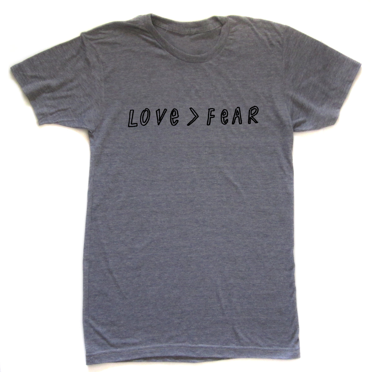 A gray t-shirt with the text "LOVE > FEAR" printed on it.