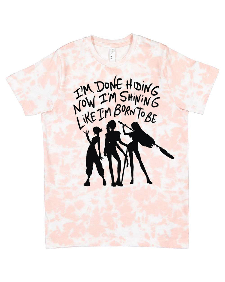 A t-shirt with a graphic design featuring silhouettes of three people and text that reads "I'm done hiding now I'm shining like I'm born to be".