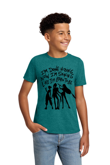 A young boy wearing a green t-shirt with a graphic design and text printed on it.