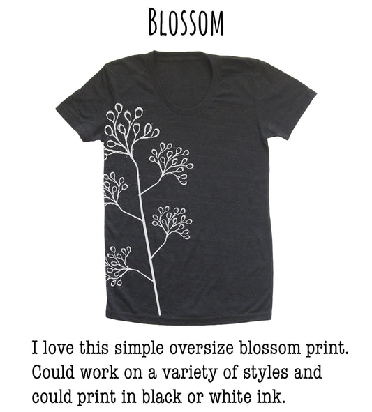 A black t-shirt with a simple white floral design on the side.
