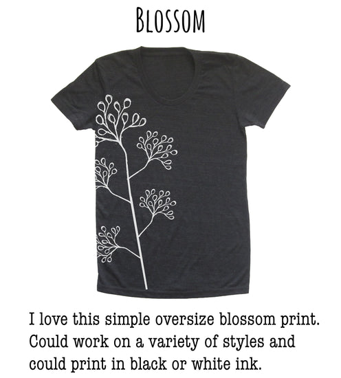 A black t-shirt with a simple white floral design on the side.