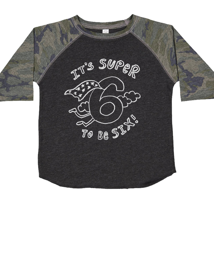 A gray and camouflage long-sleeved shirt with a graphic design and text printed on it.