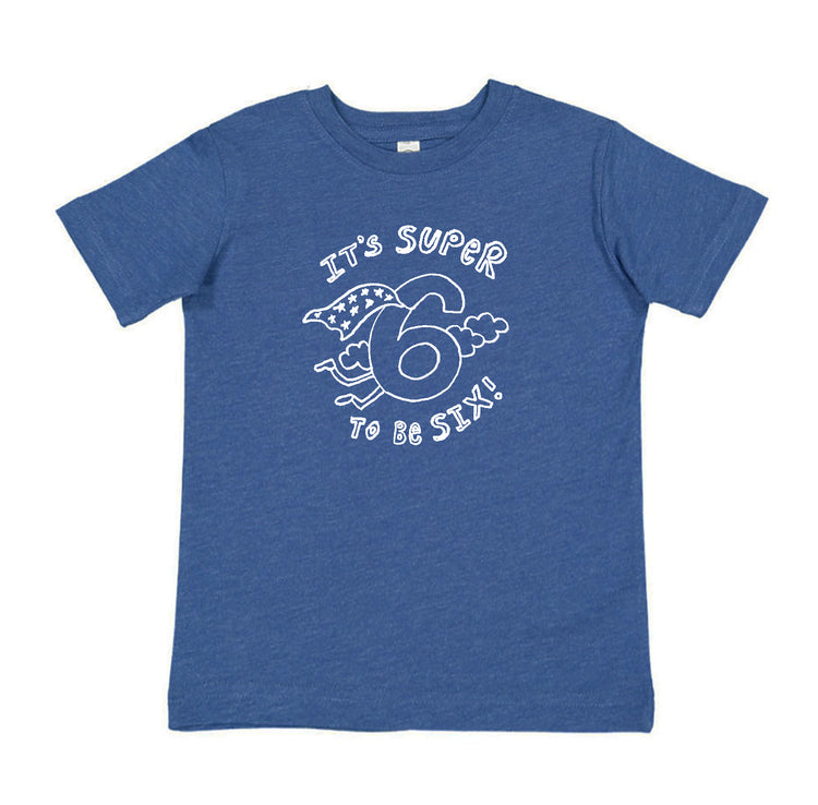 A blue t-shirt with a white graphic design that says "It's super to be six!"