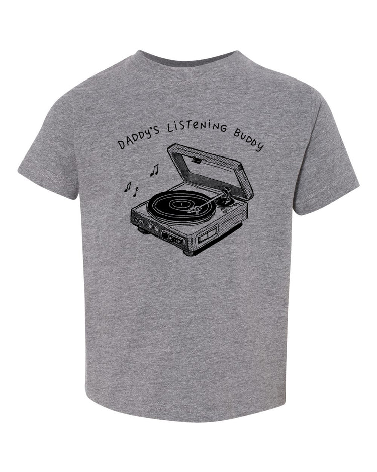 A gray t-shirt with a graphic design depicting a vinyl record player and the text "DADDA'S LISTENING BUDDY" printed on it.
