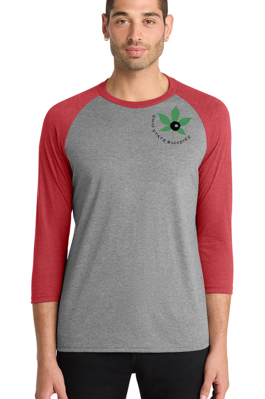 A man wearing a gray and red baseball tee shirt with a graphic of a leaf and the text "Ohio State Buckeye" on the front.