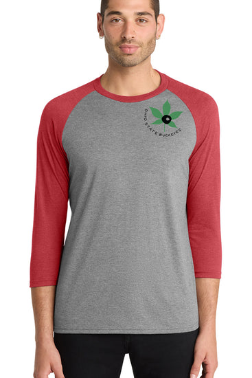 A man wearing a gray and red baseball tee shirt with a graphic of a leaf and the text "Ohio State Buckeye" on the front.
