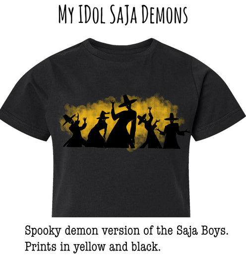 A black t-shirt with a graphic design featuring silhouettes of people in spooky costumes against a yellow and black background.