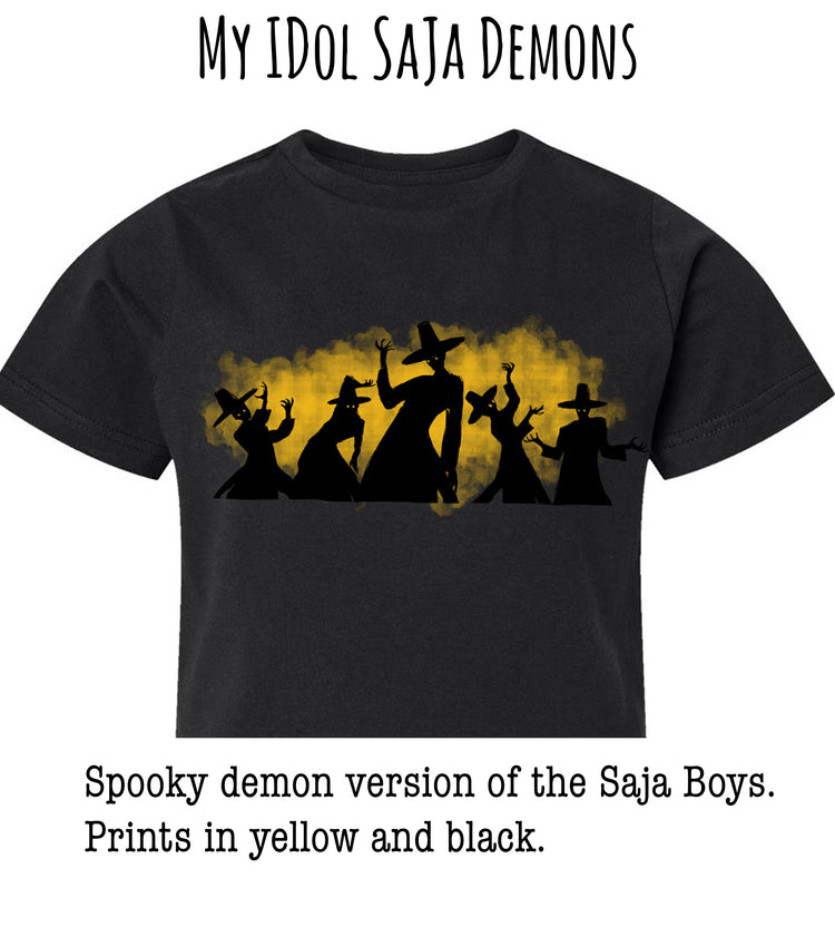A black t-shirt with a graphic design featuring silhouettes of people in spooky costumes against a yellow and black background.