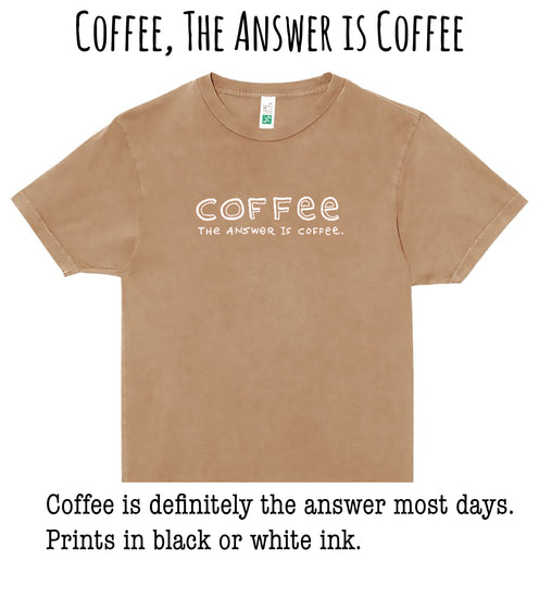 A beige t-shirt with the text "COFFEE, THE ANSWER IS COFFEE" printed on it.