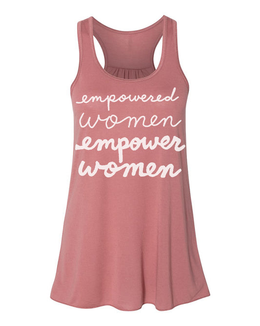 A pink tank top with the text "empowered women empower women" printed on it in white cursive font.