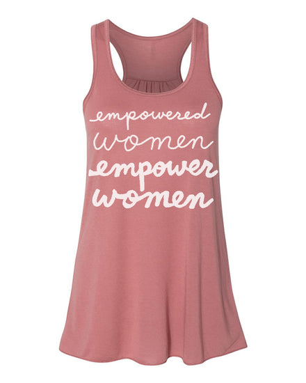 A pink tank top with the text "empowered women empower women" printed on it in white cursive font.