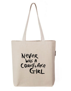 a white tote bag with black writing that says never was a cornflake