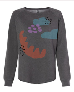 a grey sweatshirt with an image of a dinosaur on it