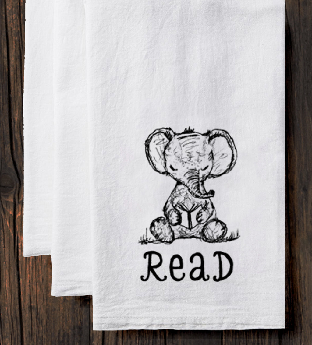 a pair of white towels with a drawing of an elephant