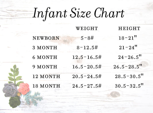 a white wooden table topped with flowers and a sign