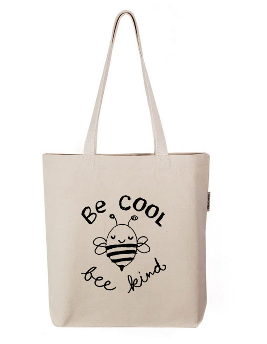 a white tote bag with a bee on it